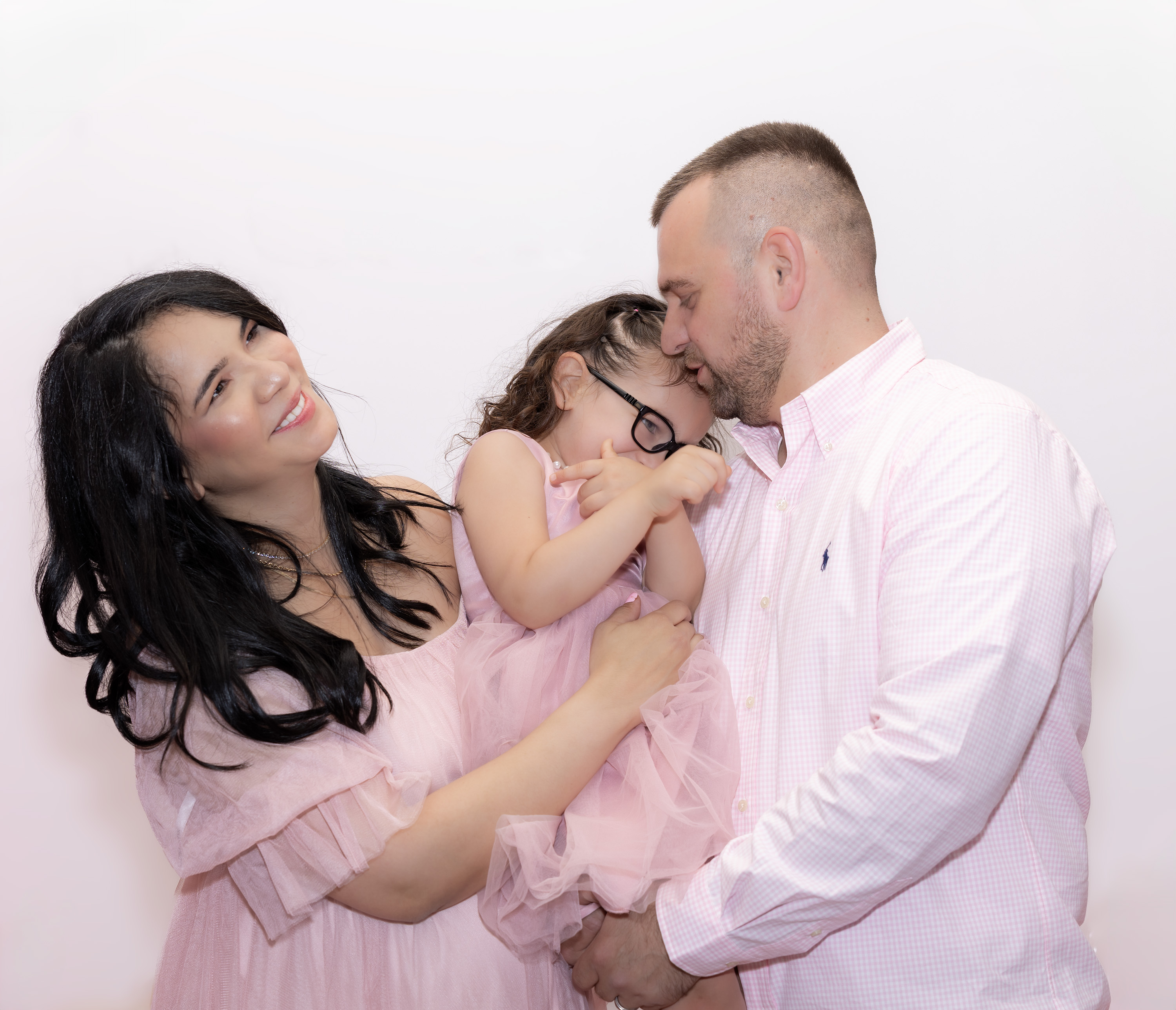 Northern Virginia family photography session featuring a family laughing with their little girl in a indoor session.